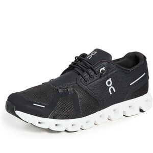 On Running Womens Athletic shoes. Black and white. Sleek lightweight.